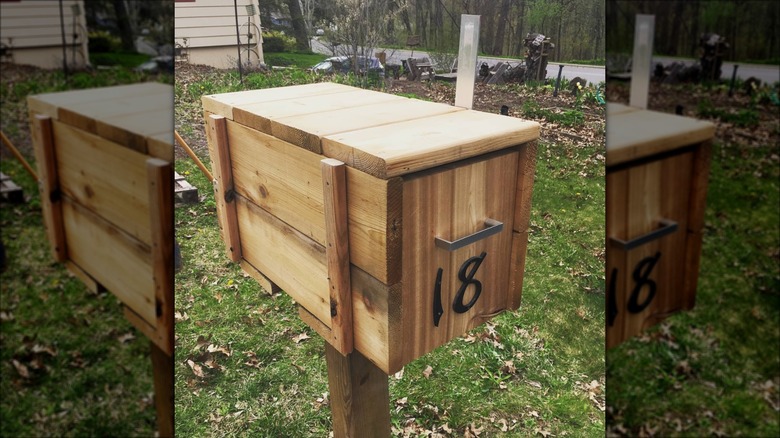 homemade wooden mailbox on post