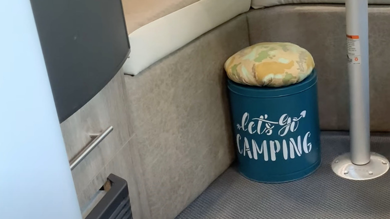 camping storage ottoman on floor