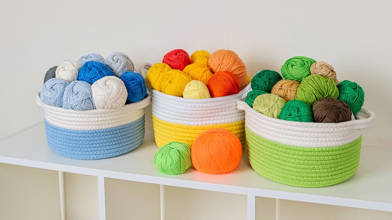 colorful buckets full of yarn