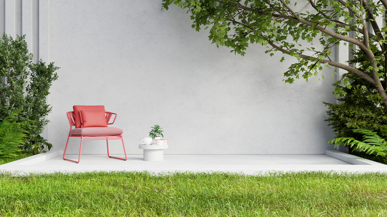 Blank outdoor wall with chair