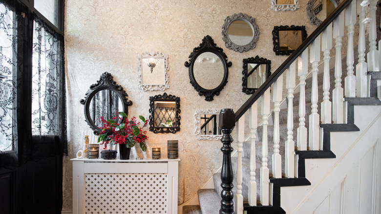 A gallery wall of antique statement mirrors