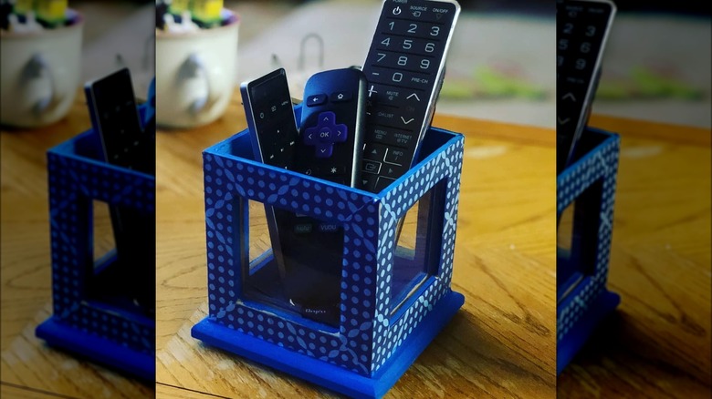 Remotes in photo frame holder