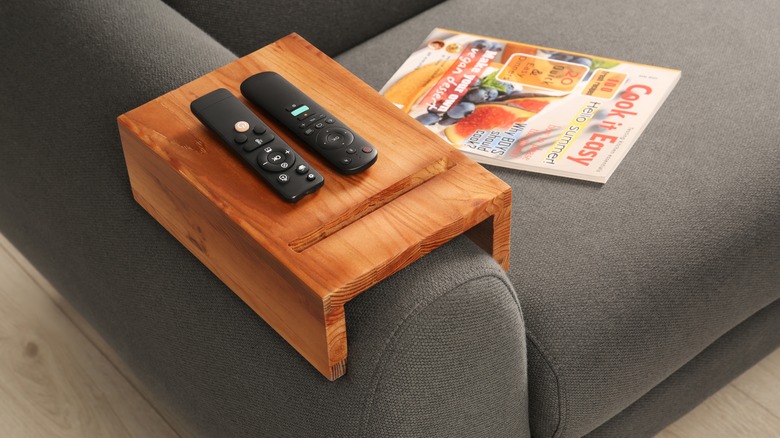 Remotes on sofa armrest