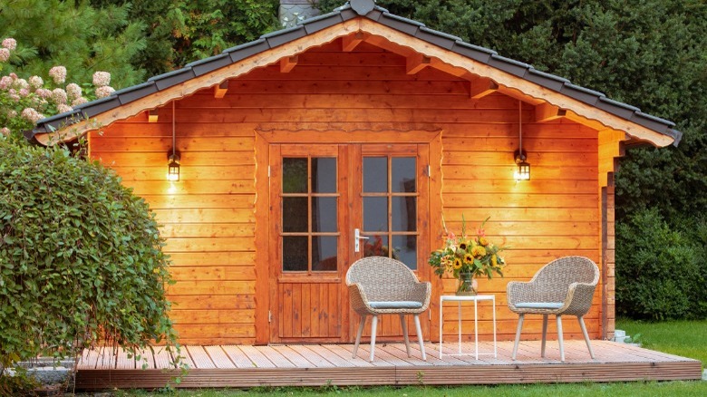 Outdoor shed at night with lights 