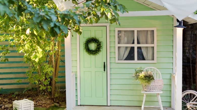 Charming small green outdoor shed 