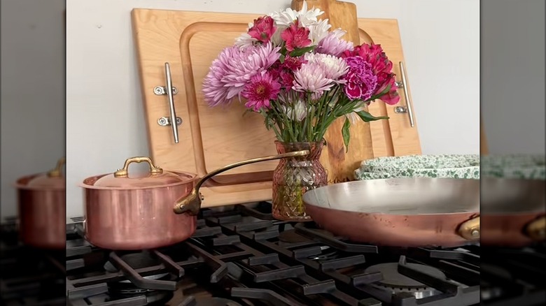 Copper pot and pan on the top of a stove