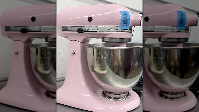 Pink Kitchen Aid standing mixer in a thrift store