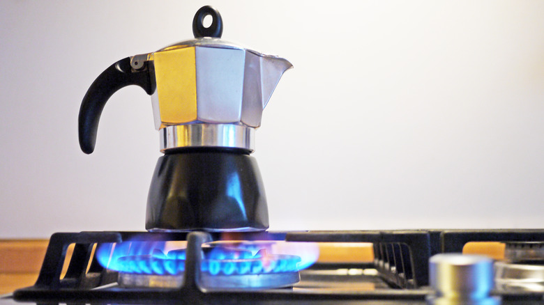 coffee pot brewing on a stove top 