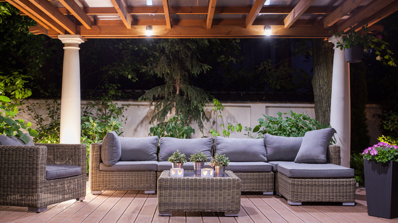 Wood pergola with patio furniture