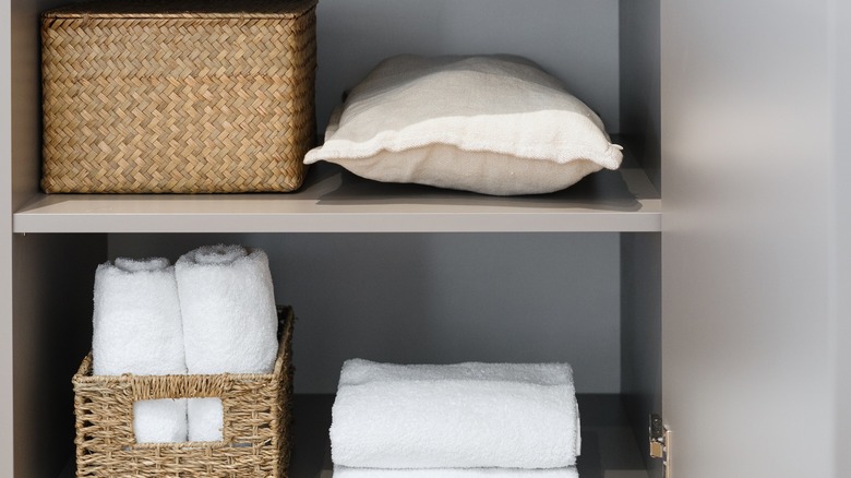 Wicker baskets in bathroom cabinet