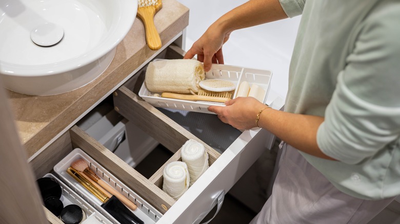 Woman organizing drawer