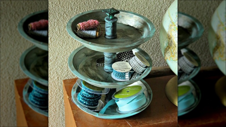 Twine and ribbon in metal tiered tray