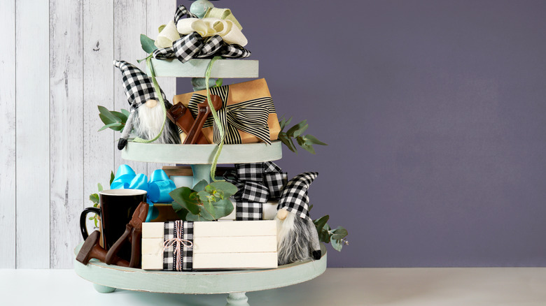 Light green tiered tray filled with decorations