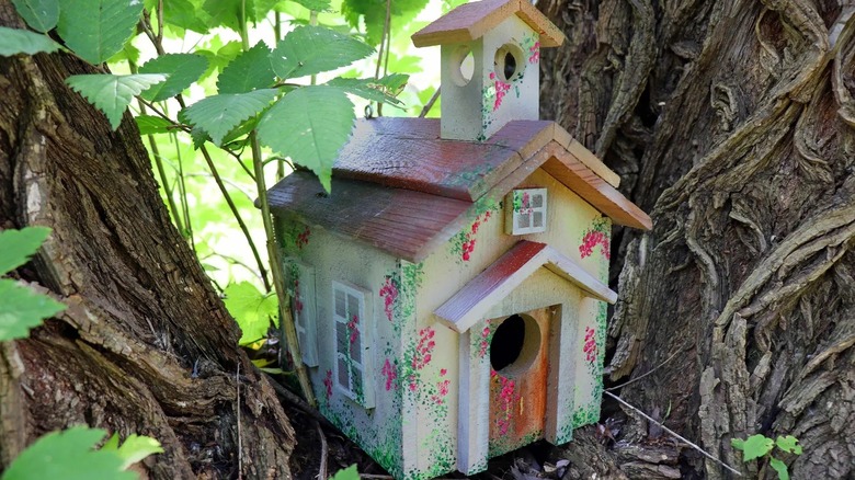 wooden schoolhouse bird home