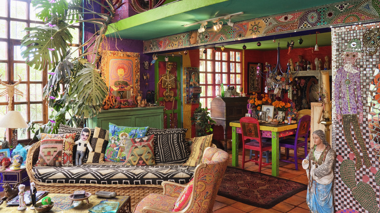 Living room filled to overflowing with decor and bright colors