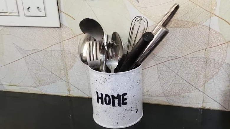 Coffee canister repurposed as utensil holder