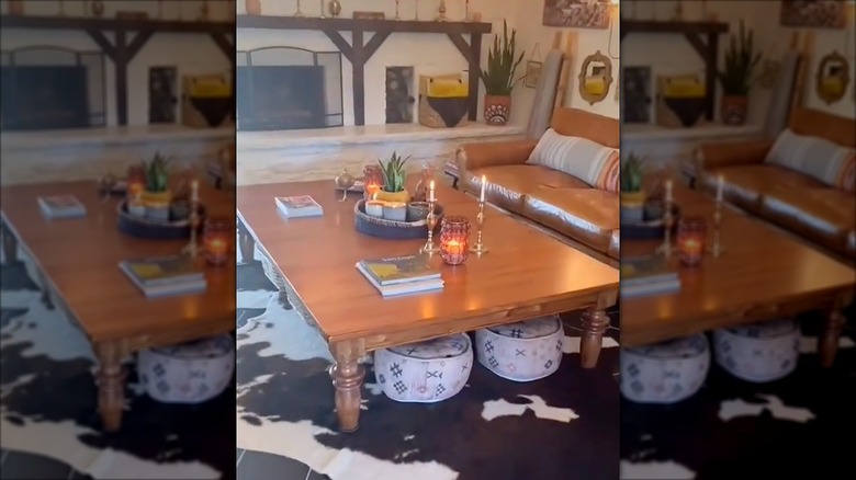 Large wooden coffee table in living room made from an old dining table