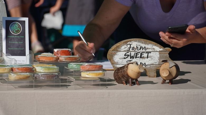 Vendor selling desserts on a table at a farmers market