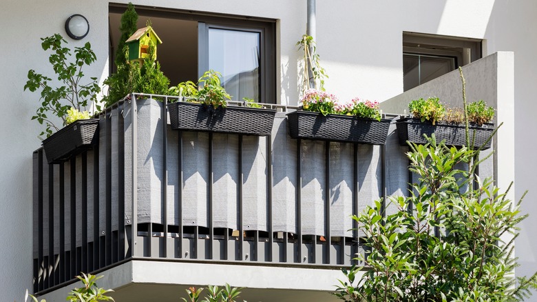 Fabric mounted to balcony railing