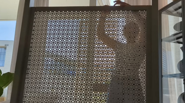 Woman assembling screen