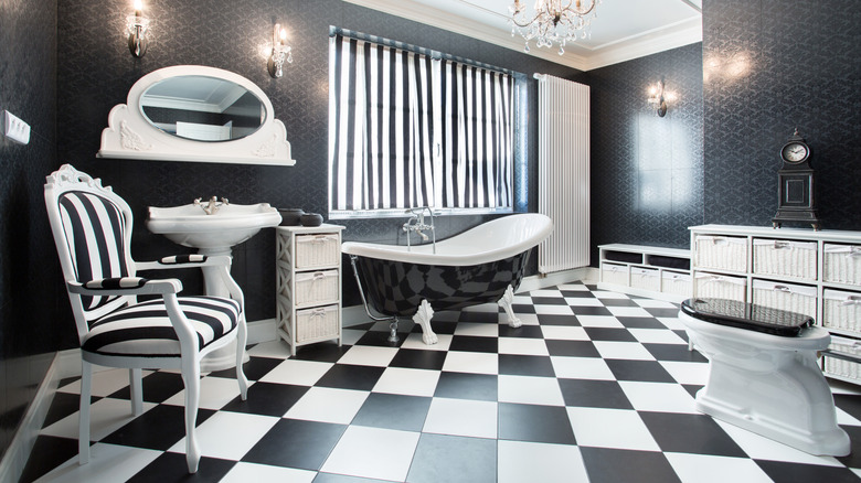 Checkerboard bathroom floor in bathroom with all white and black items