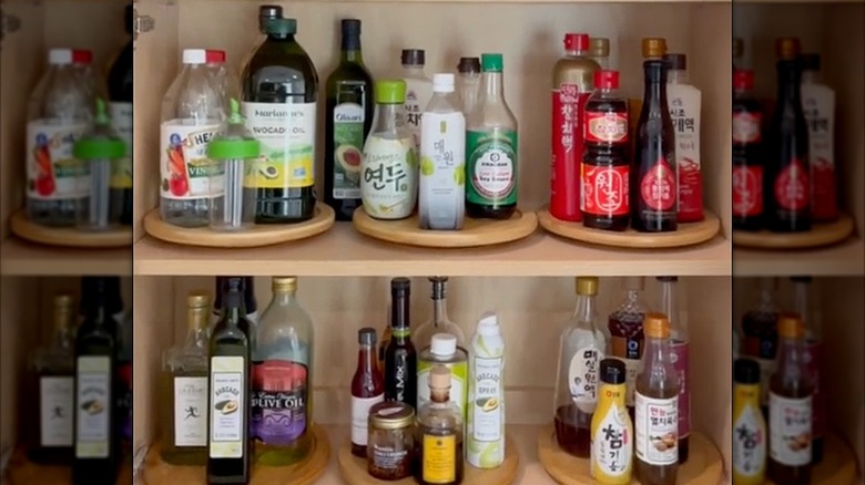 Pantry shelves organized with lazy Susans