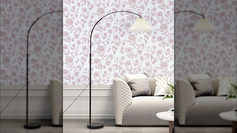 Simple pink floral wallpaper on a living room wall