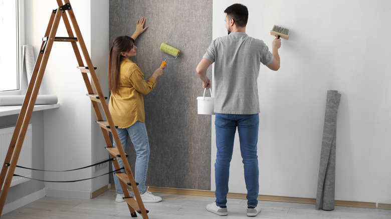 Couple hanging subtle gray wallpaper