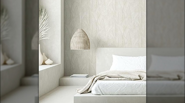 Tropical neutral wallpaper pattern on a bedroom wall