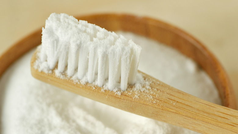 baking soda on a wooden toothbrush