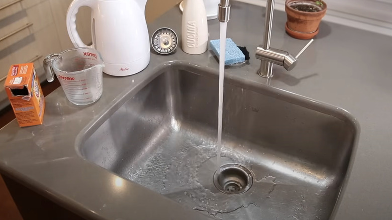running sink being cleaned with baking soda
