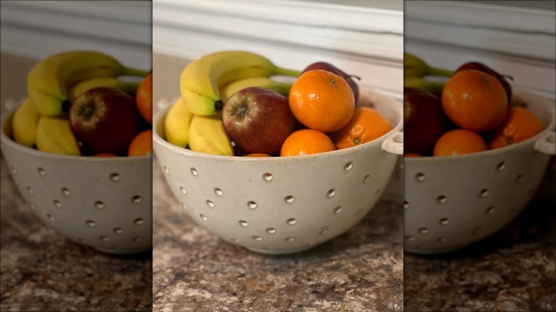 beige stoneware colander fruit bowl