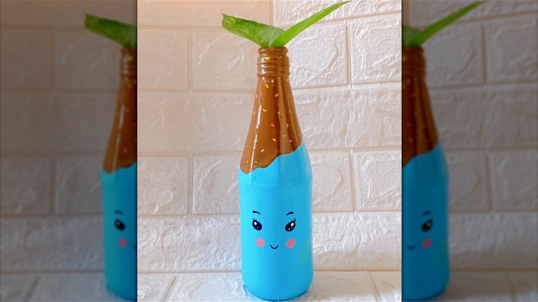 blue painted ketchup bottle vase