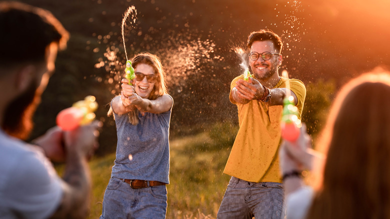 friends playing with water guns