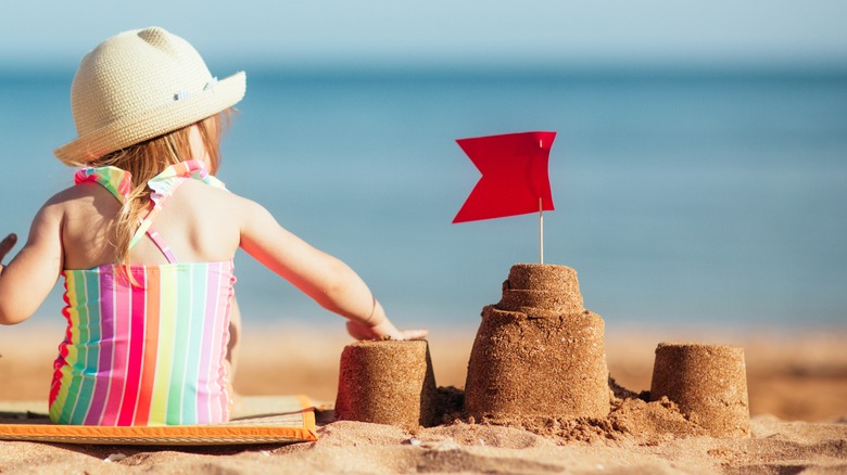 Kid making sand castles