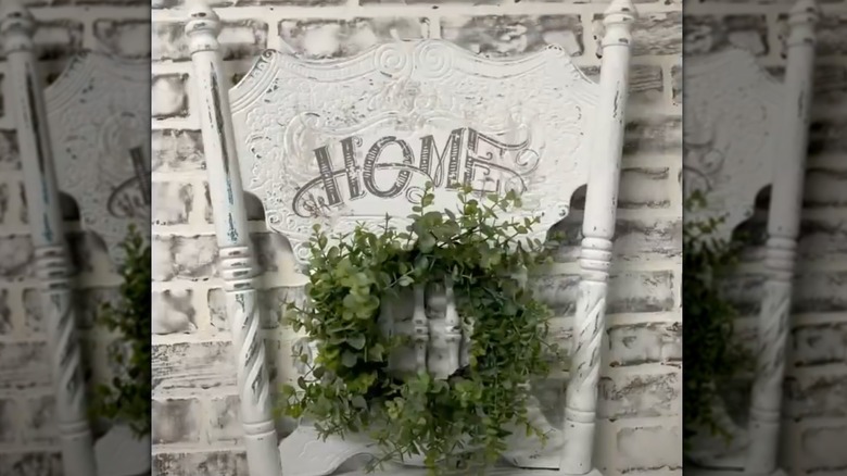 White chair backrest creates a wreath hanger