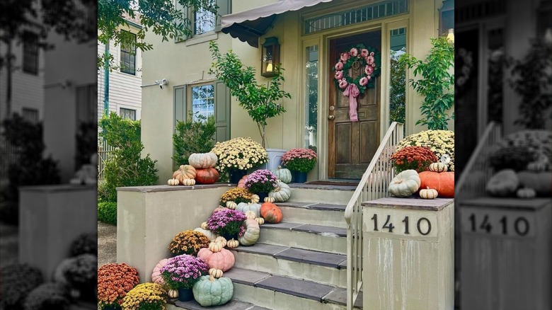 Porch steps with pumpkins and mums