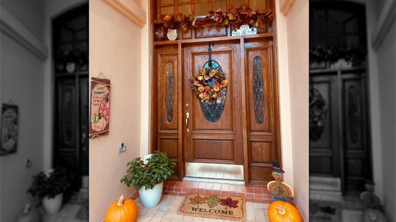 Wood front door with fall decorations