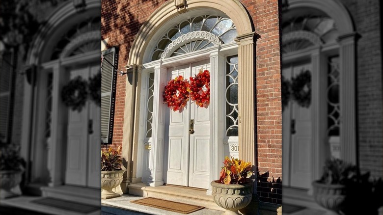 Double doors with red wreaths