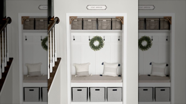 Small mudroom with bench and storage bins