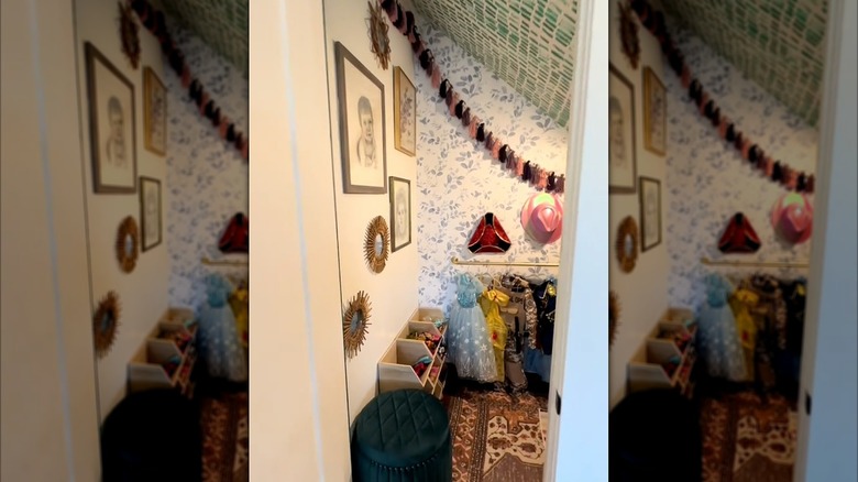 Closet turned into a playroom for kids with rug, toy shelves, and other decor