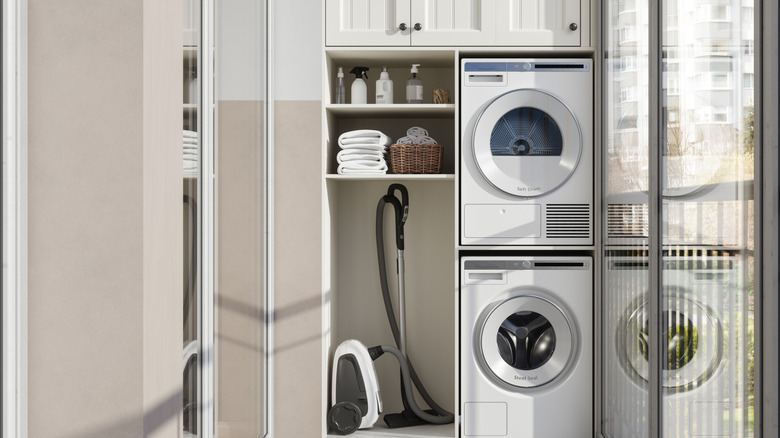 Stacked washer-dryer and laundry supplies in a patio closet