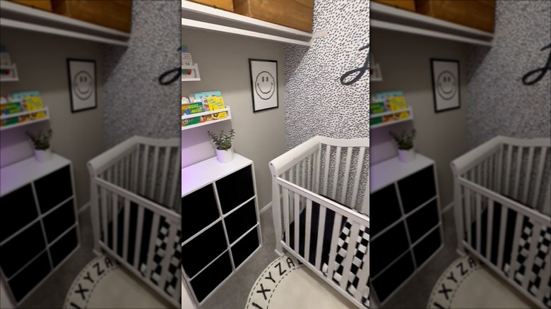 Walk-in closet repurposed into nursery with baby crib and room accessories