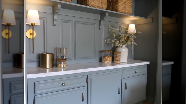 Closet makeover into a wine bar with lights and snack accessories on the counter