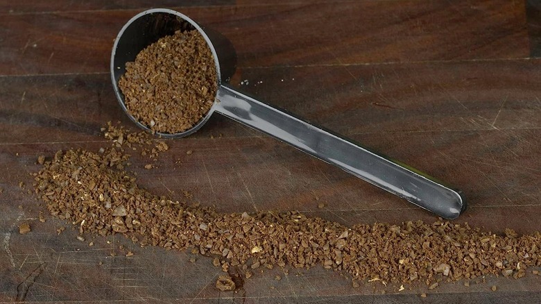 coffee grounds spilled on wood table