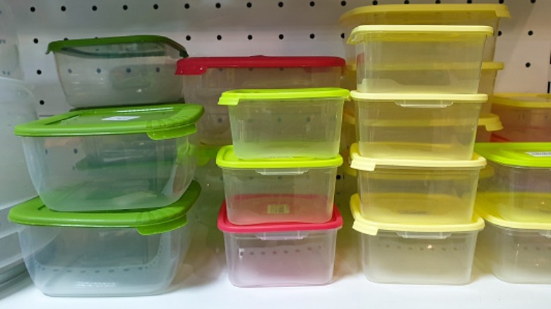 Plastic food containers with yelow, green, red lids
