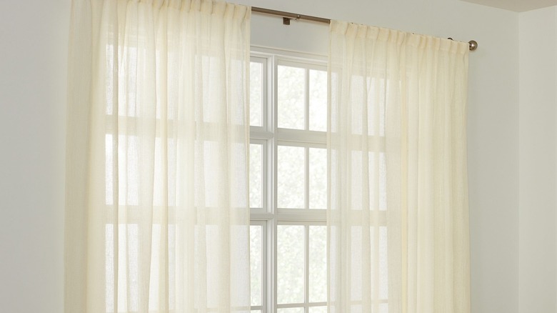 white translucent curtains over large window