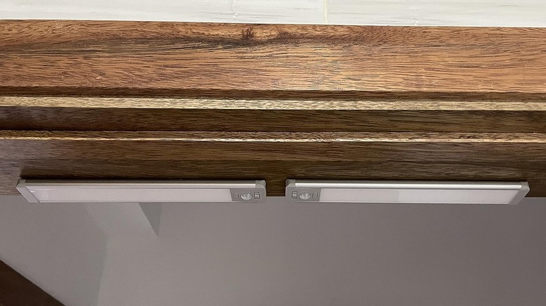 cabinet lights installed under wood