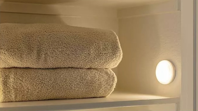 stack of towels with a light