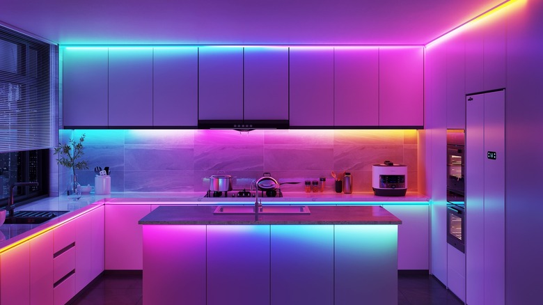 a kitchen with colorful light strips